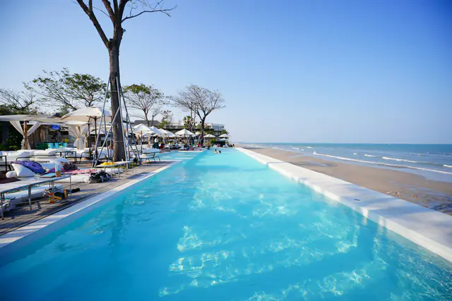 The infinity pool meeting the beach